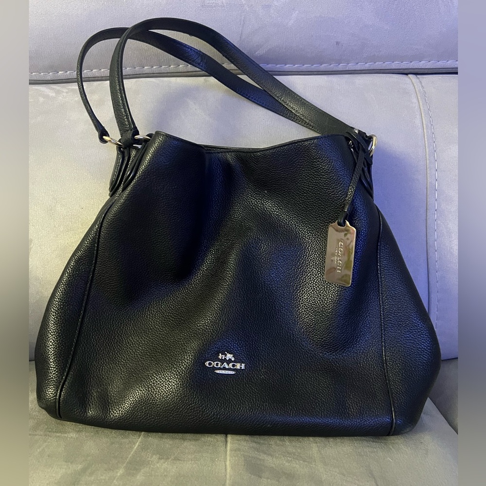 Coach black pebble leather shoulder bag with metal tag